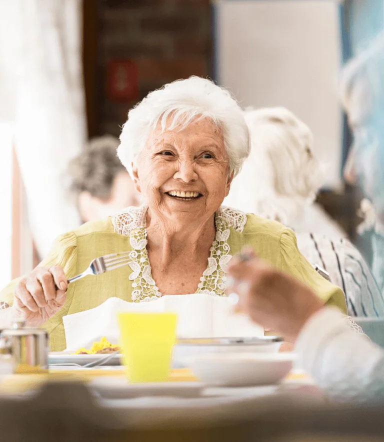 Senior woman eating dinner