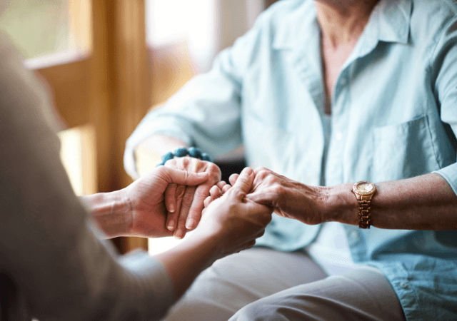 Close up of seniors holding hands